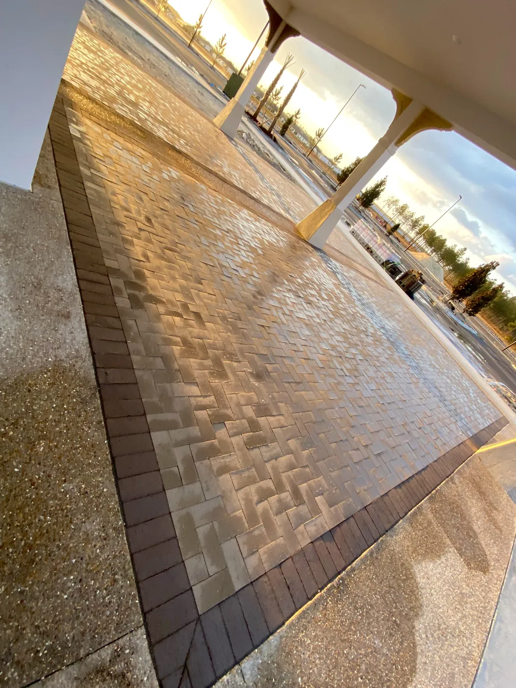 Herringbone paver patio with a dark border
